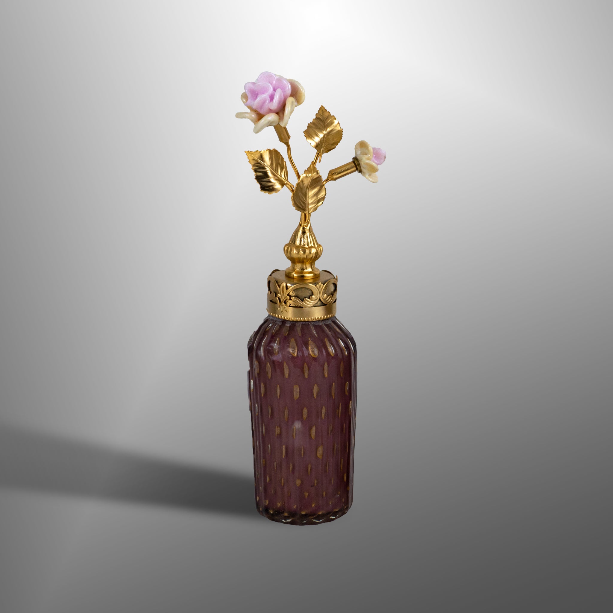 Amethyst parfume bottles with brass details and flowers