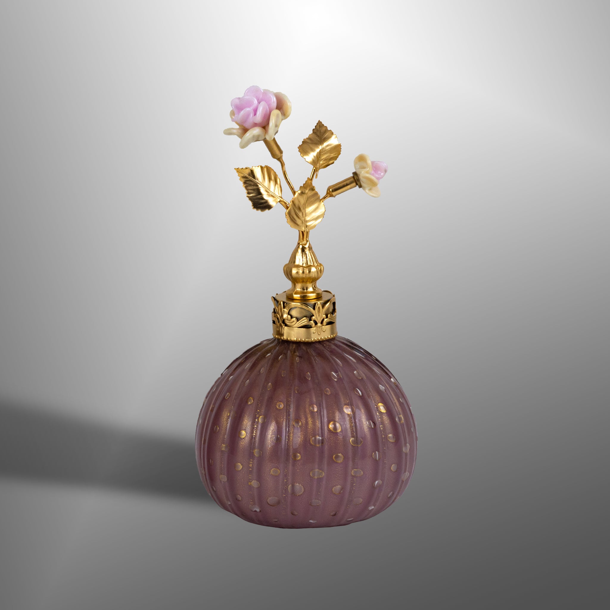 Amethyst parfume bottles with brass details and flowers
