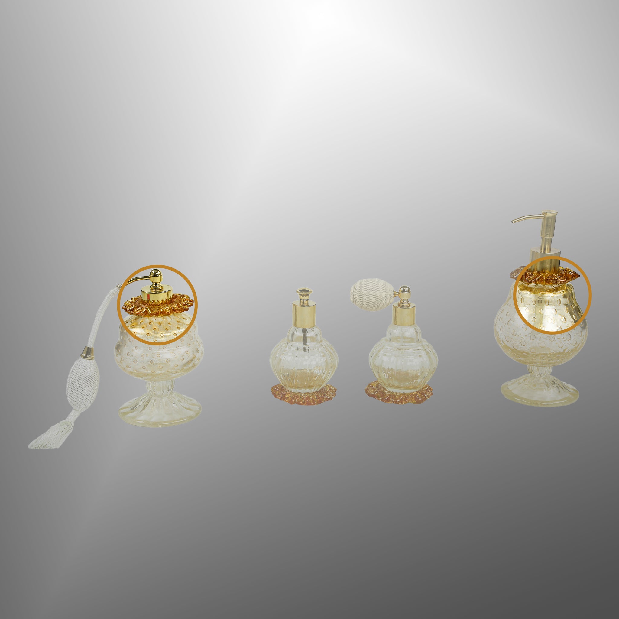 Bottiglie di profumo in oro con dettagli ambra